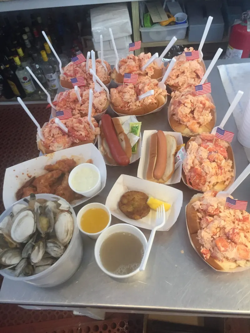 Lobster rolls, steamers and hot dogs on a tray