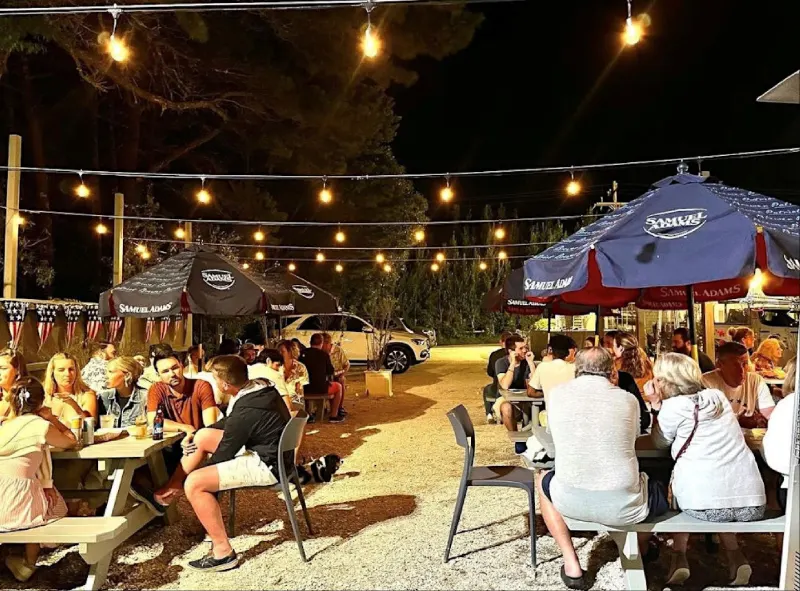 Patio lit up with string lights at night
