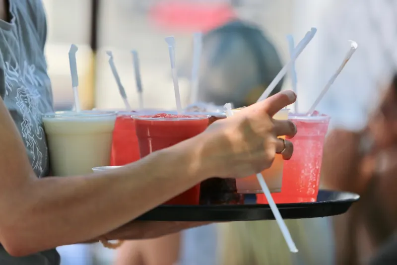 Server carrying frozen drinks